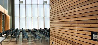 Innovation für den Objektbau mit sicherem Brandschutz: Schwer entflammbare Vollholzprofile für innen und außen