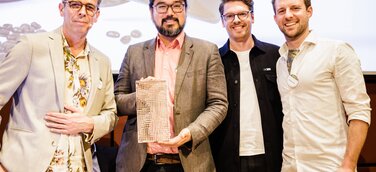 DIO Studios und Plastic2Beans bei der Übergabe des Green Product Award